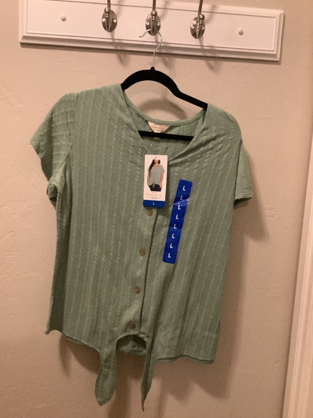 A woman’s light weight short, sleeved sweater